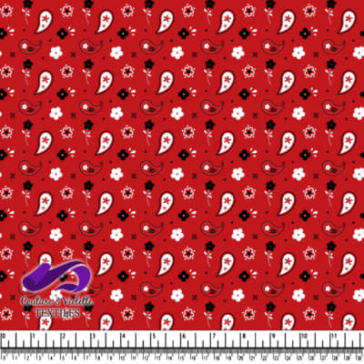 Red fabric pattern with white and black flowers and paisley shapes