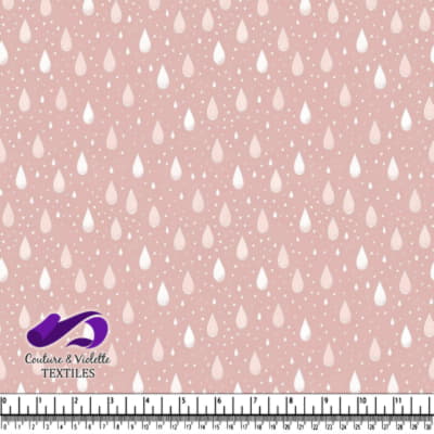 Soft pink fabric with white raindrop pattern design