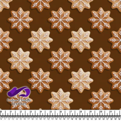 Snowflake shaped gingerbread cookies with white icing