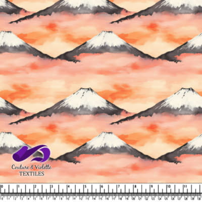 Snow capped mountains with orange misty sky background