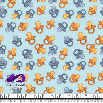 Pattern of Baby Pacifiers on Blue Background